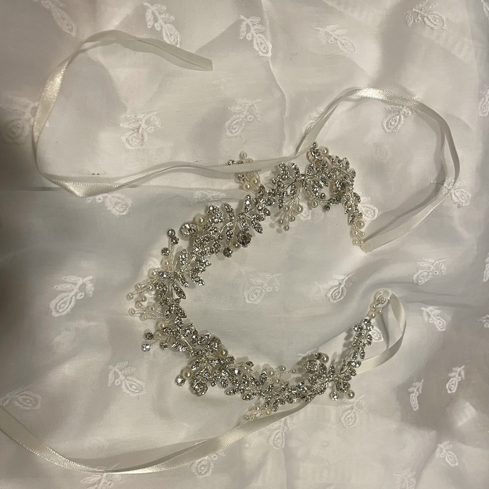 Delicate flower hair accessories accented with rhinestones and artificial pearls
